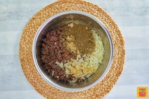 onions and garlic added to ground beef in instant pot