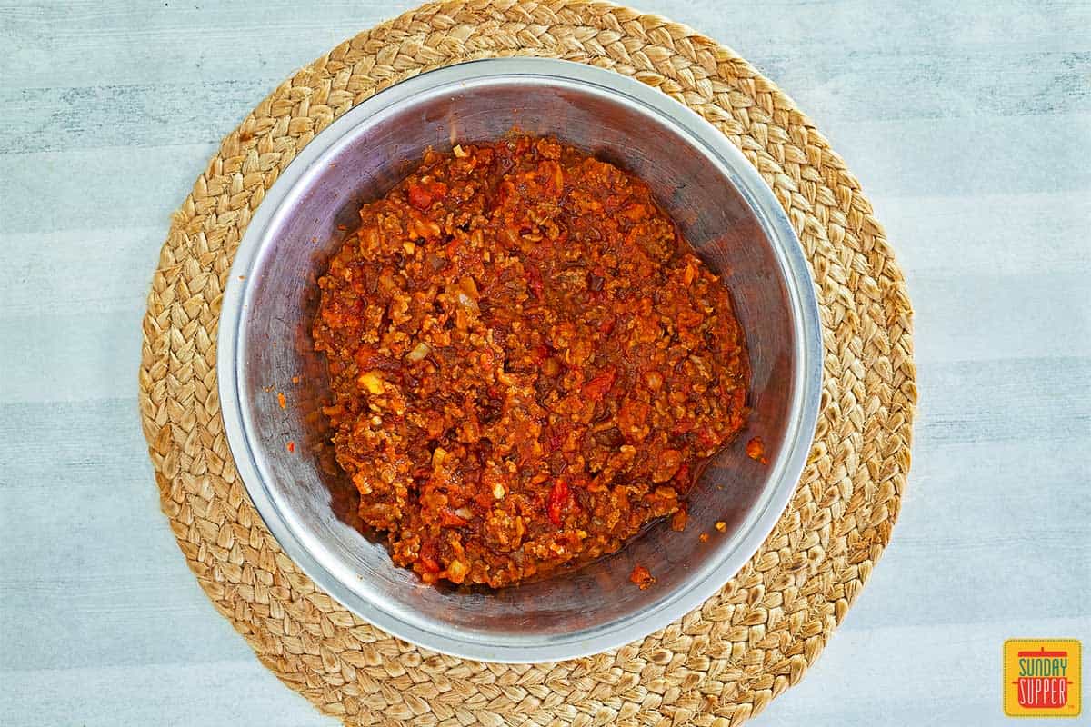 mixing marinara sauce into ground beef in instant pot