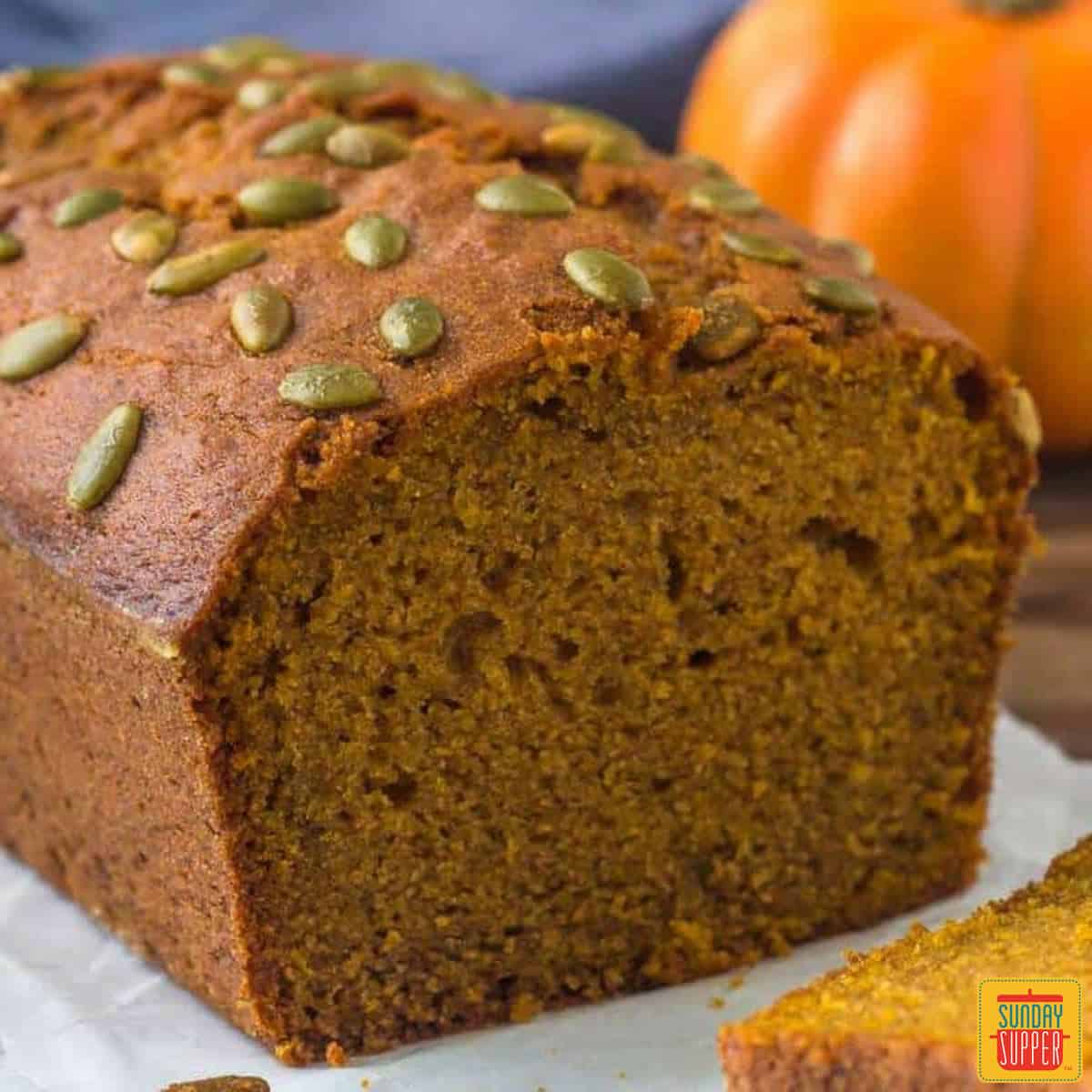 Starbucks pumpkin bread loaf with pumpkin seeds on top