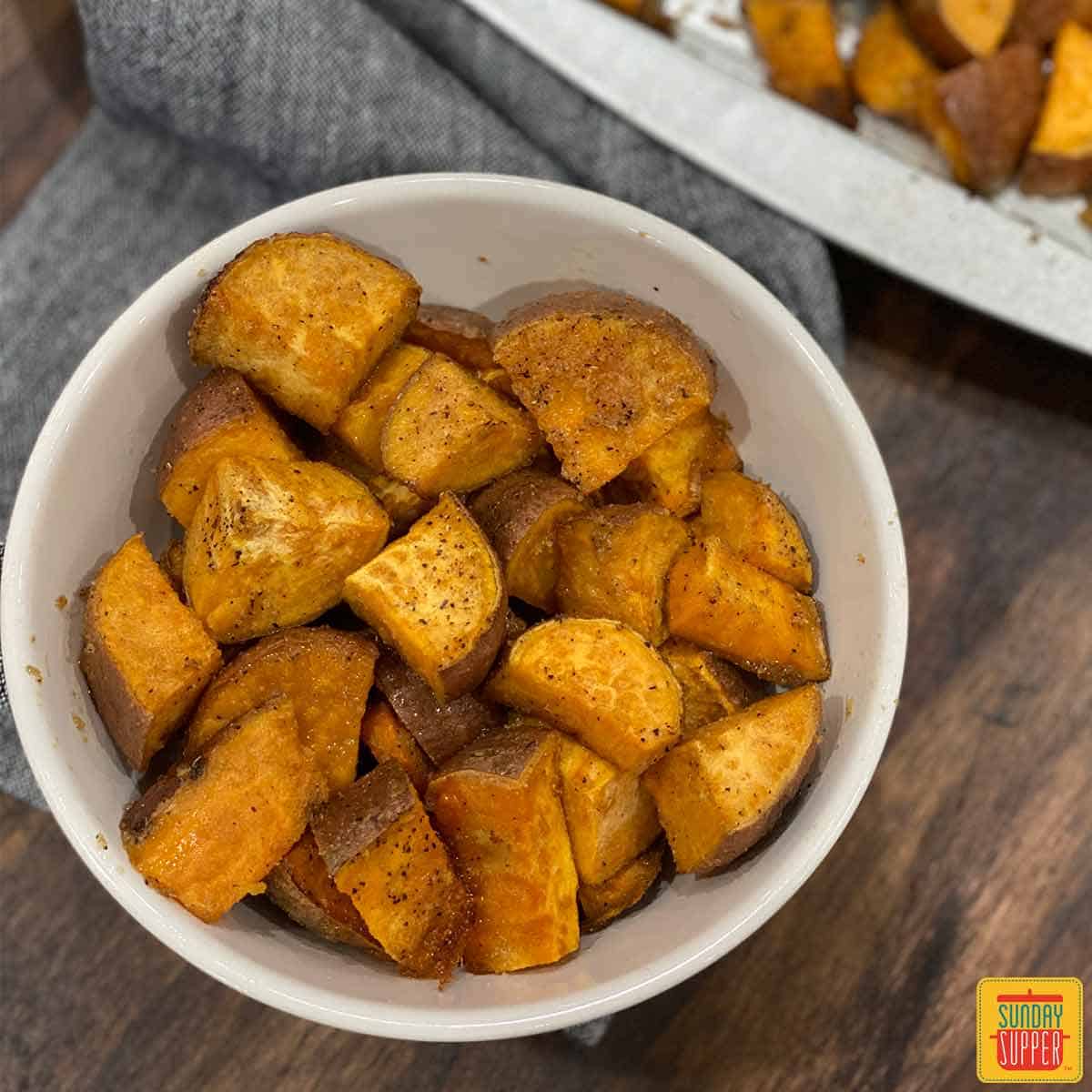 Roasted sweet potatoes in a white bowl