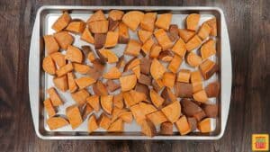 Cubed sweeet potatoes on a baking sheet