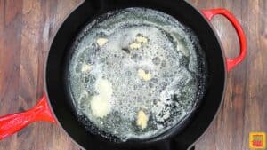 Cooking down butter and garlic in a skillet