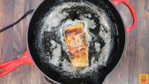 Cooking salmon skin-side down in a skillet