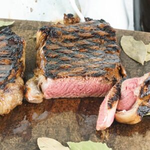a juicy steak sliced on a cutting board