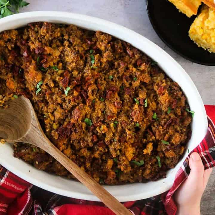 Portuguese Stuffing in a white dish with a wooden spoon