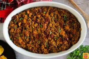 thanksgiving stuffing with chorizo in a white serving bowl