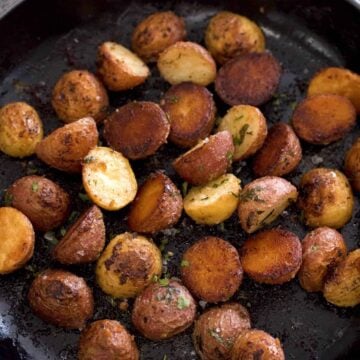 Roasted small potatoes in a skillet