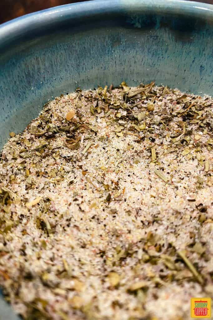 rosemary salt close up in a blue bowl