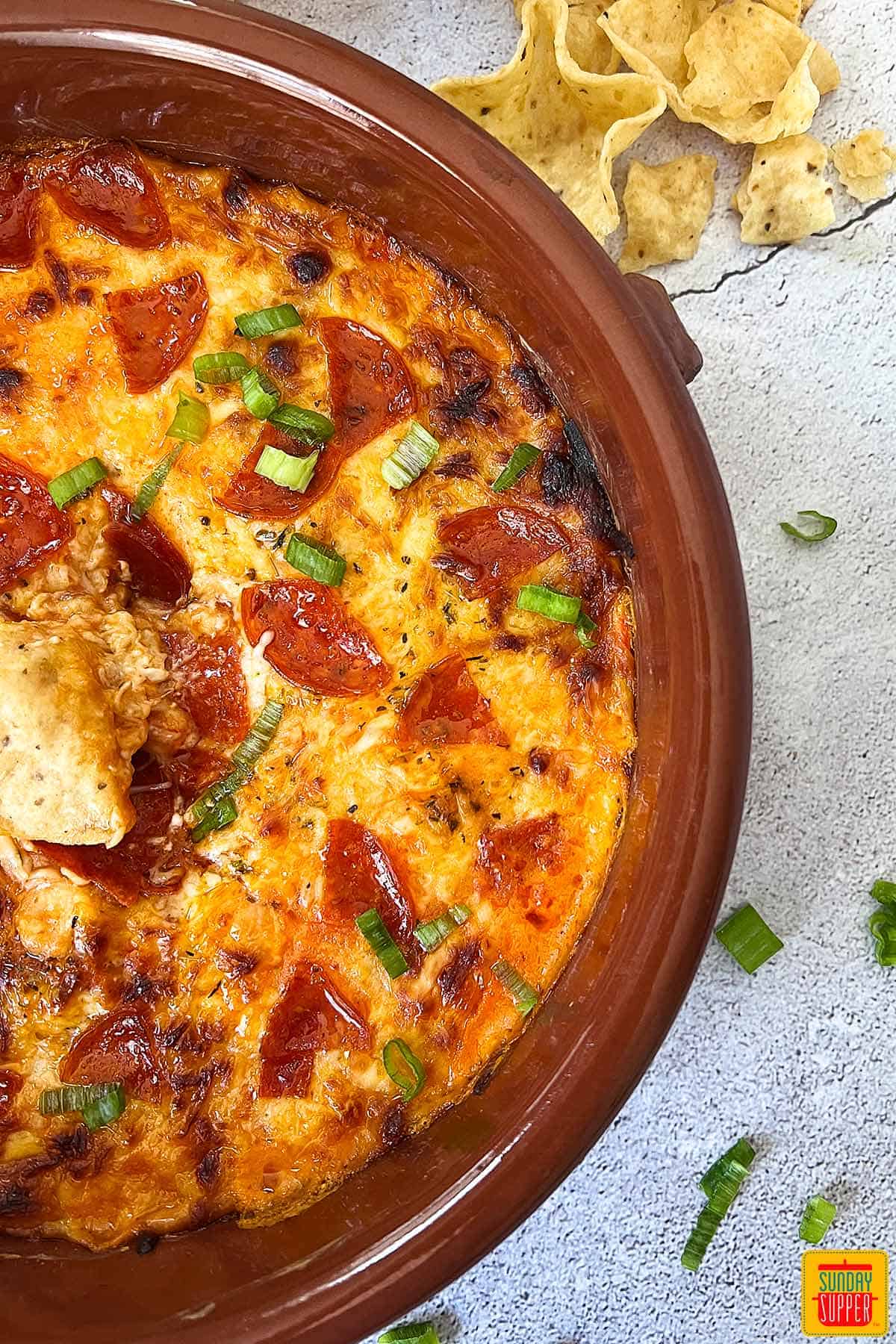 pizza dip in a brown baking dish
