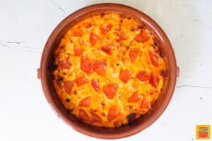 pizza dip after being baked in a brown baking dish