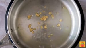 Cooking garlic in a pan