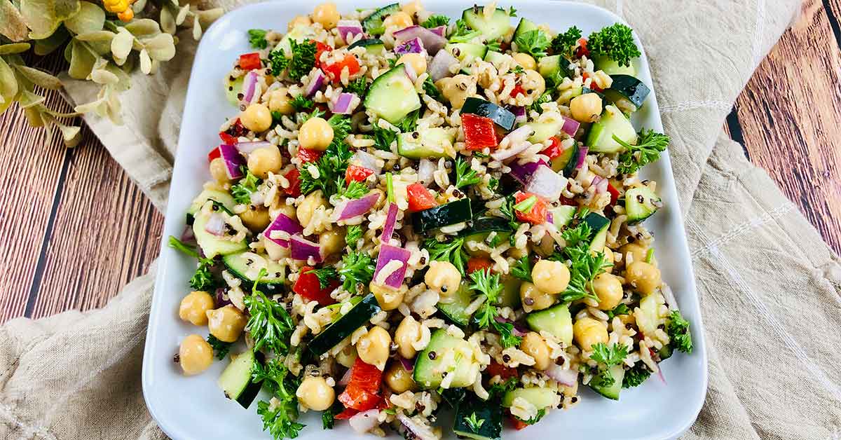 Cold quinoa salad on a white platter