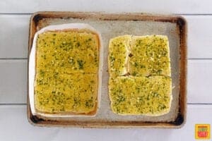 spread honey garlic butter mixture over Hawaiian rolls