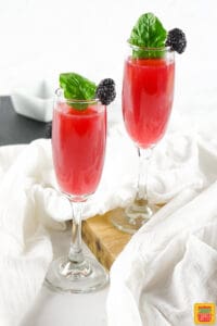 Two enery drink cocktails with mint and berries
