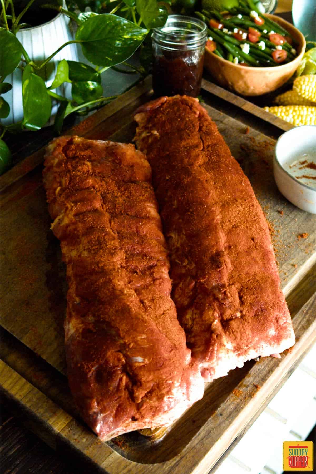 Seasoned ribs on a cutting board