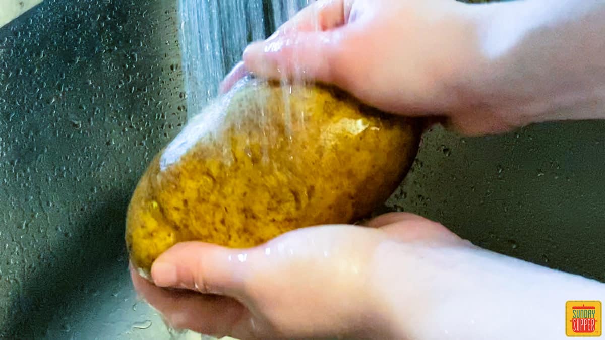 Washing a russet potato