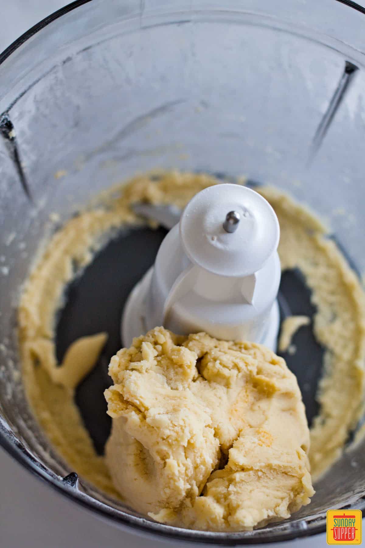 Empanada dough in the food processor after mixing