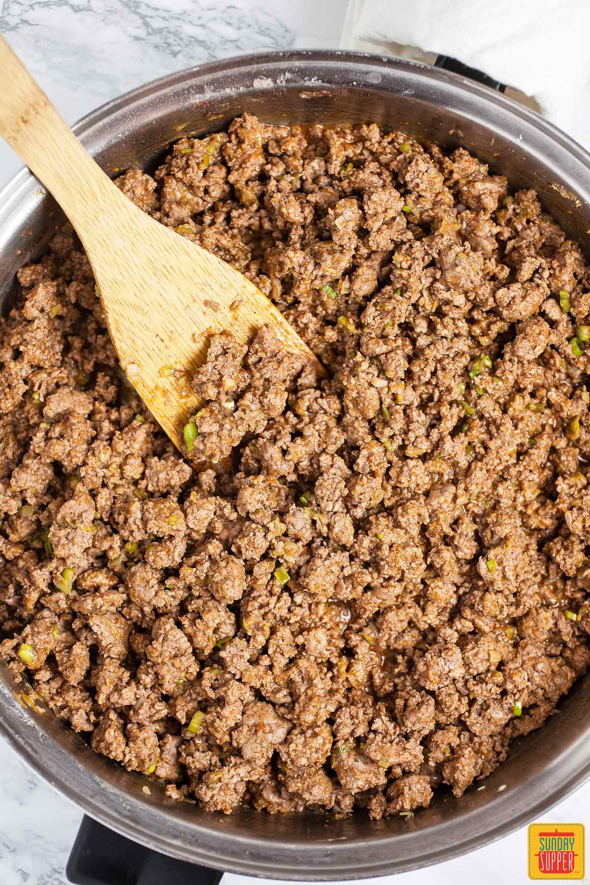 Cooked ground beef.