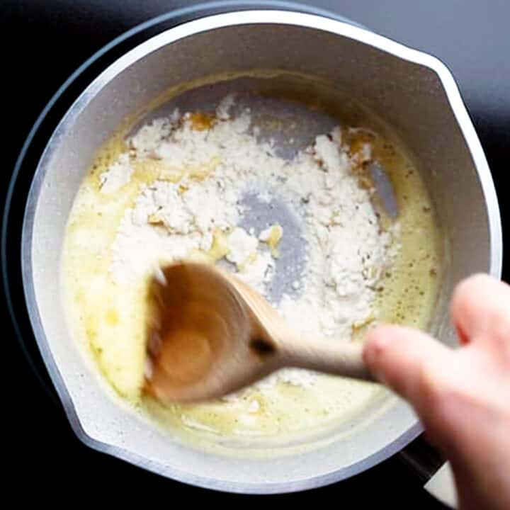 Roux in a pot with a wooden spoon