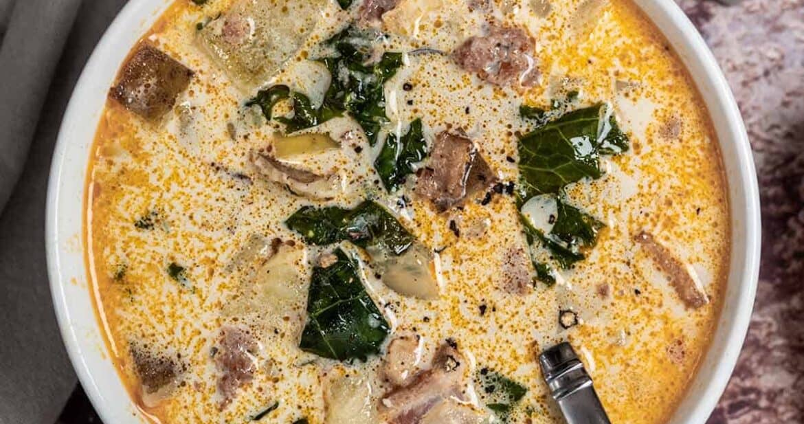 A bowl of instant pot zuppa toscana with a spoon