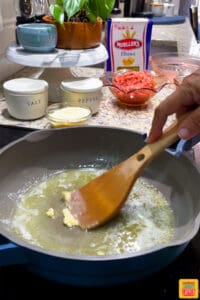Melting butter and sauteing garlic