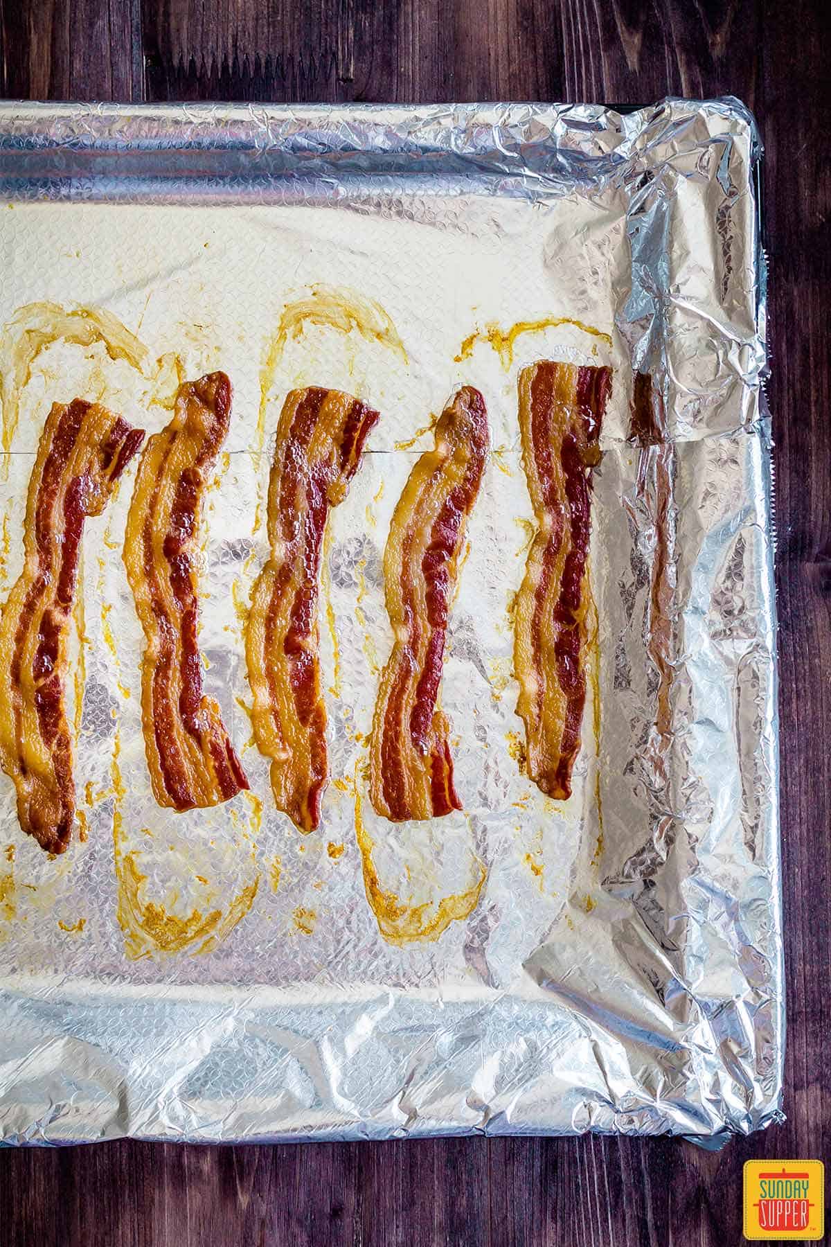 Cooked bacon on tinfoil