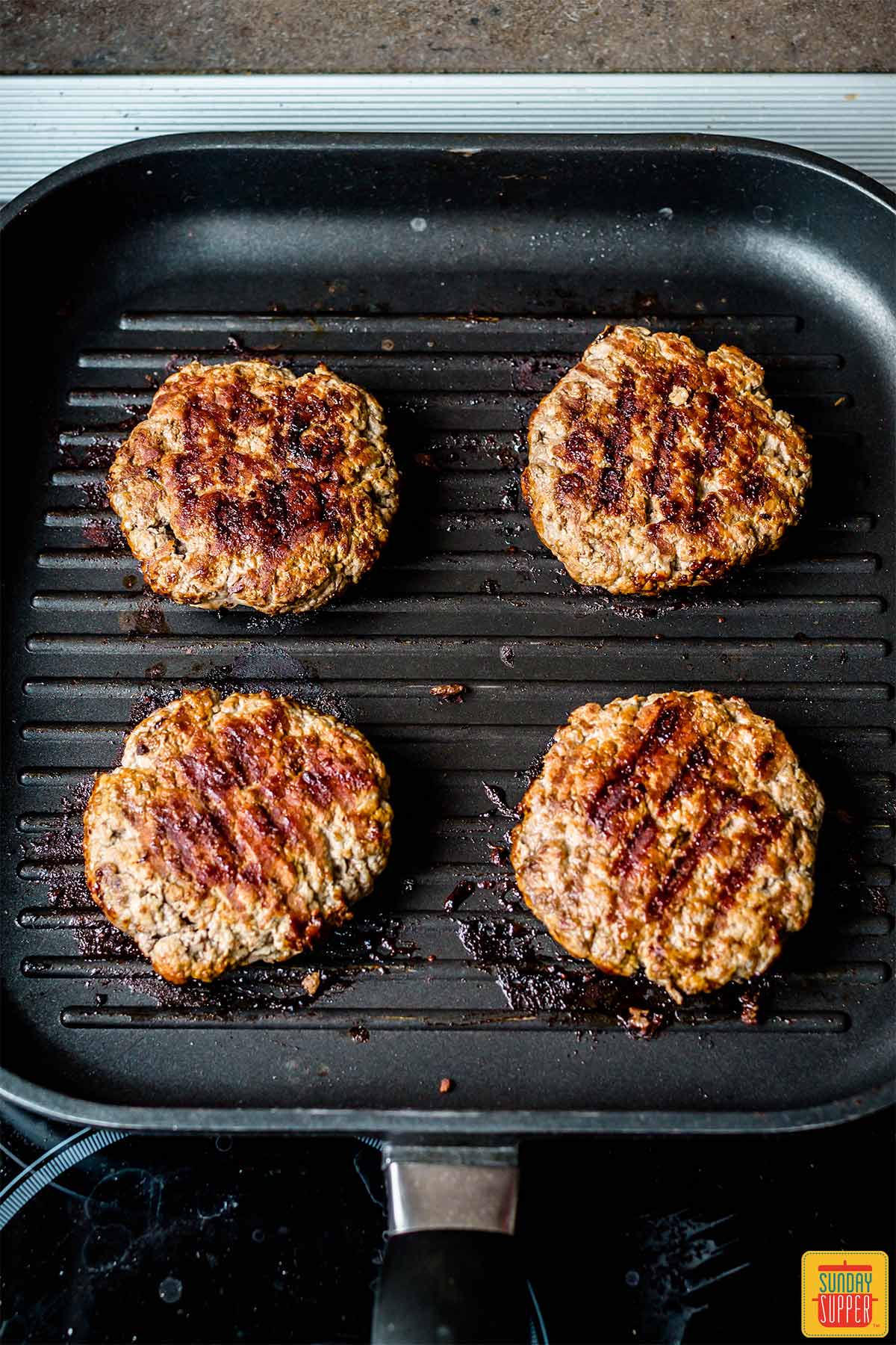 Cooked patties on the grill