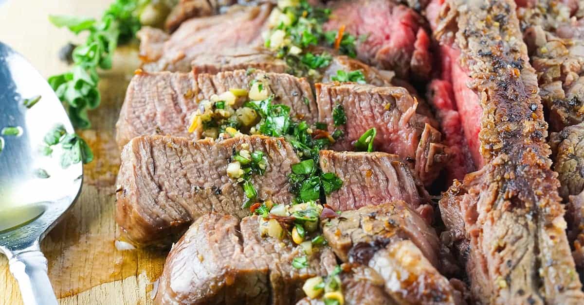 Slices of porterhouse steak on a cutting board