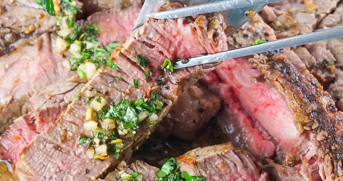 Slicing steak on a cutting board
