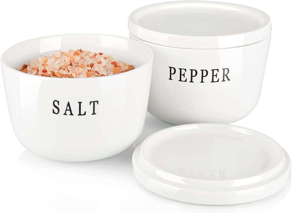 white salt and pepper cellars labeled with names