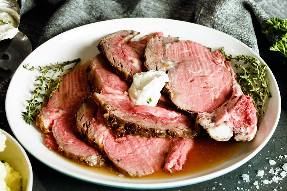 horseradish sauce with prime rib on a plate