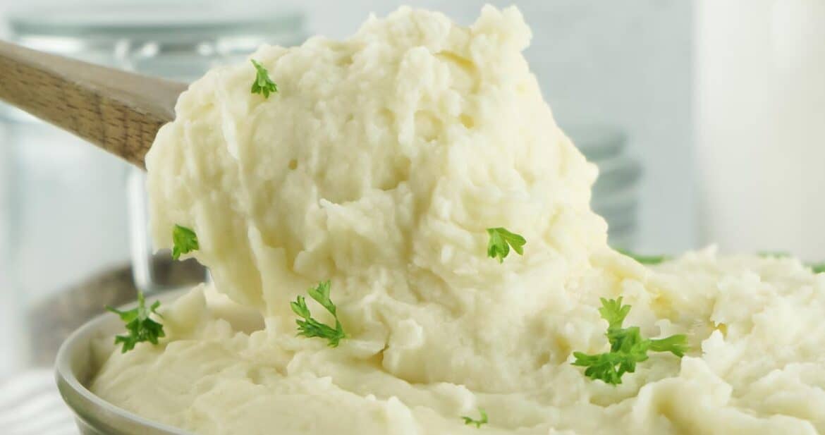 spoonful of instant pot mashed potatoes over a bowl