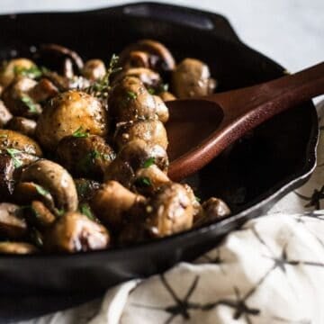 button mushrooms in a saute pan