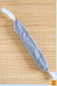 Chocolate salami rolled in baking paper