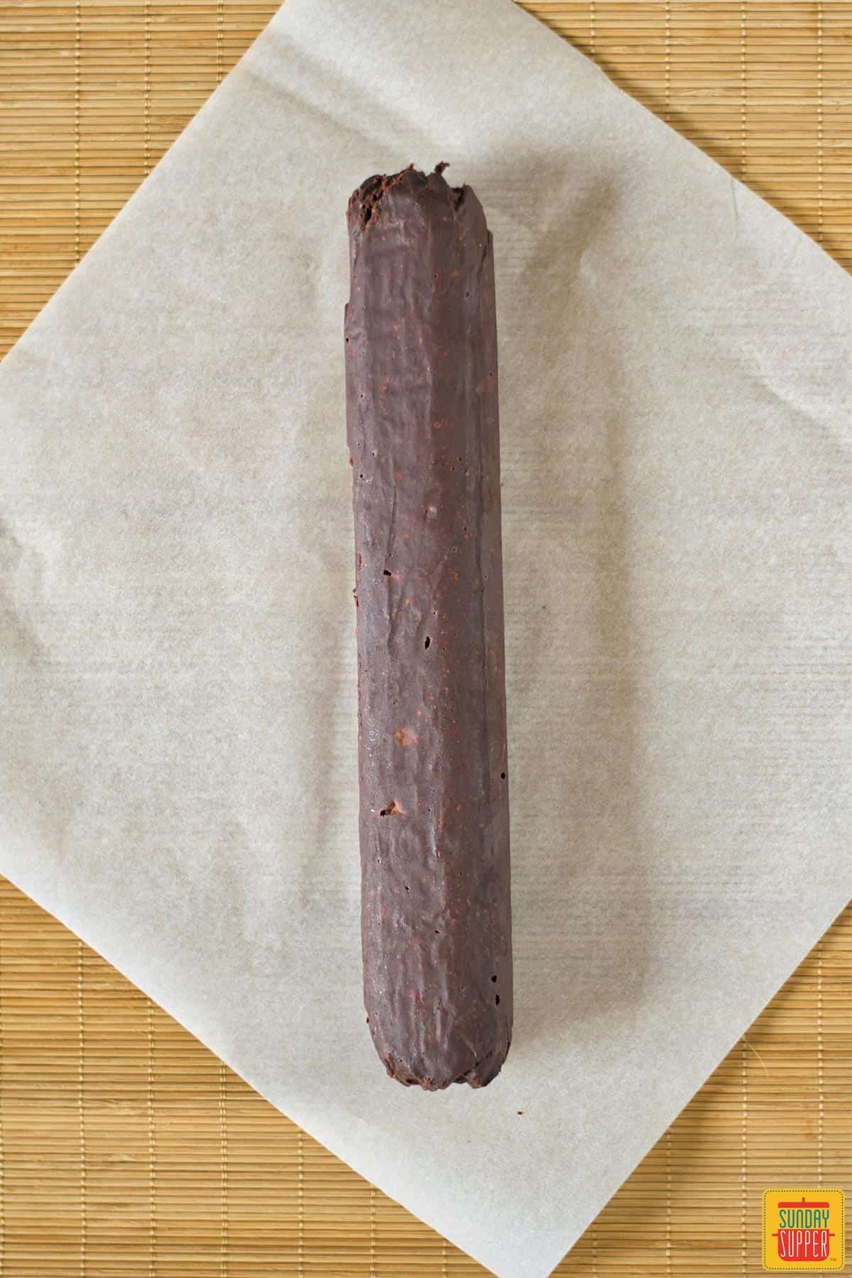 Frozen chocolate salami log ready to be sliced