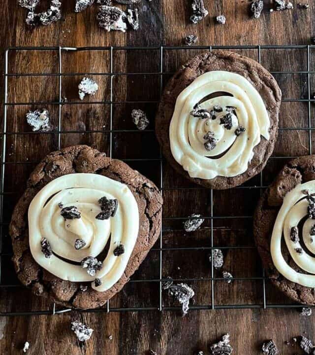 three crumbl cookies on a baking rack