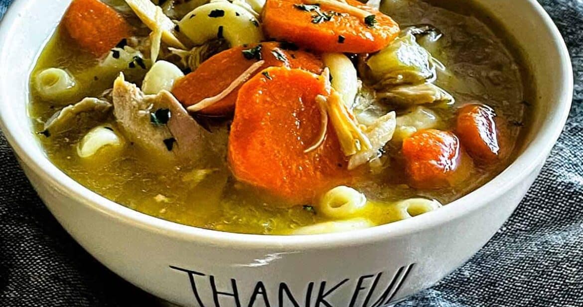 Turkey carcass soup in a bowl that says thankful