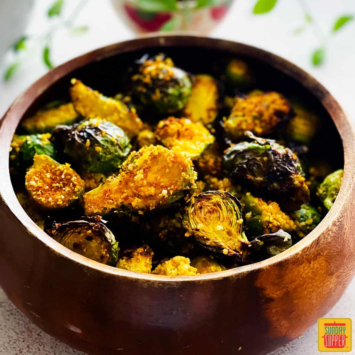 air fryer brussels sprouts in a wooden bowl