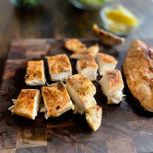 Beautiful grilled chicken breast on a cutting board