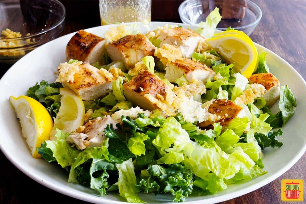 Complete chick-fil-a lemon kale caesar salad on a white plate