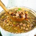 spoonful of instant pot bean soup over bowl