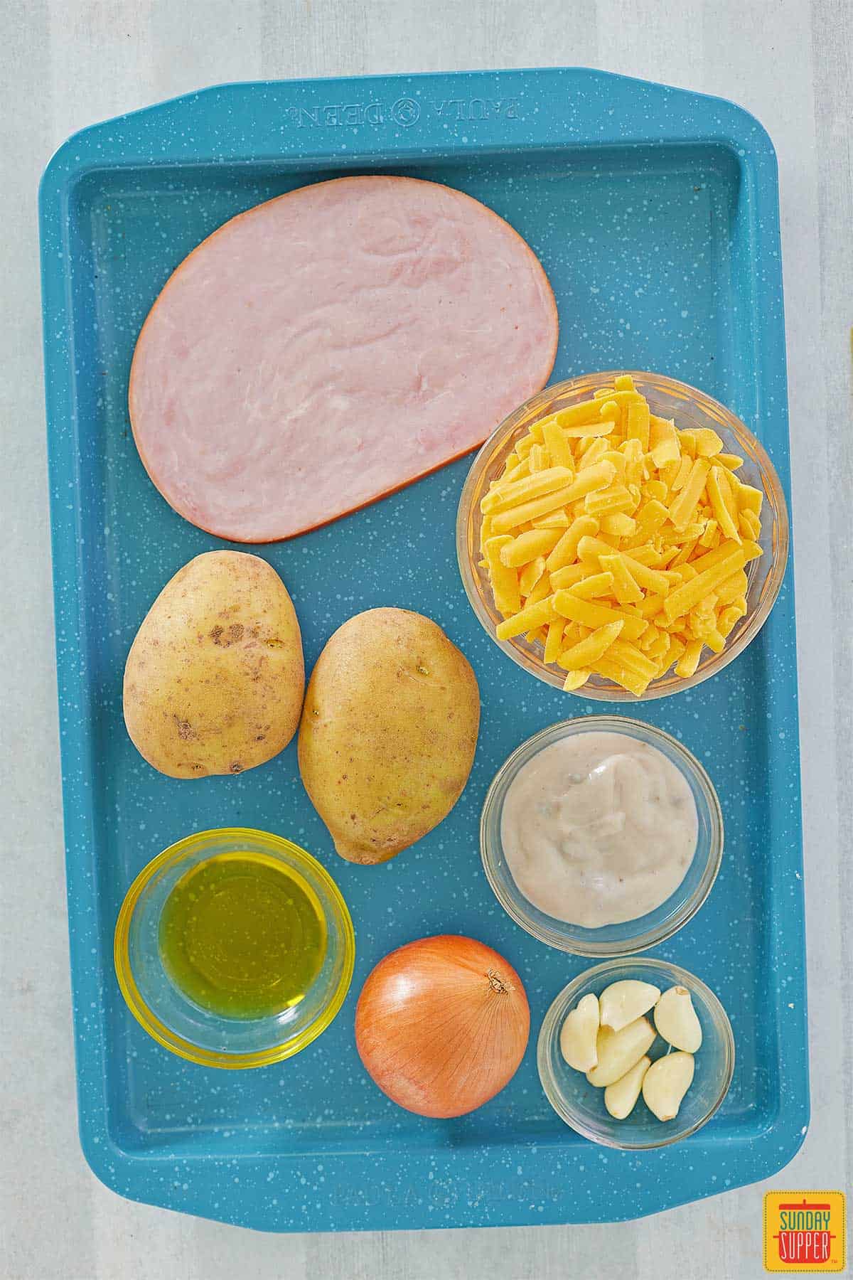 ham casserole ingredients on a tray
