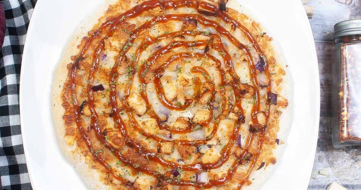 bbq chicken pizza on a white plate