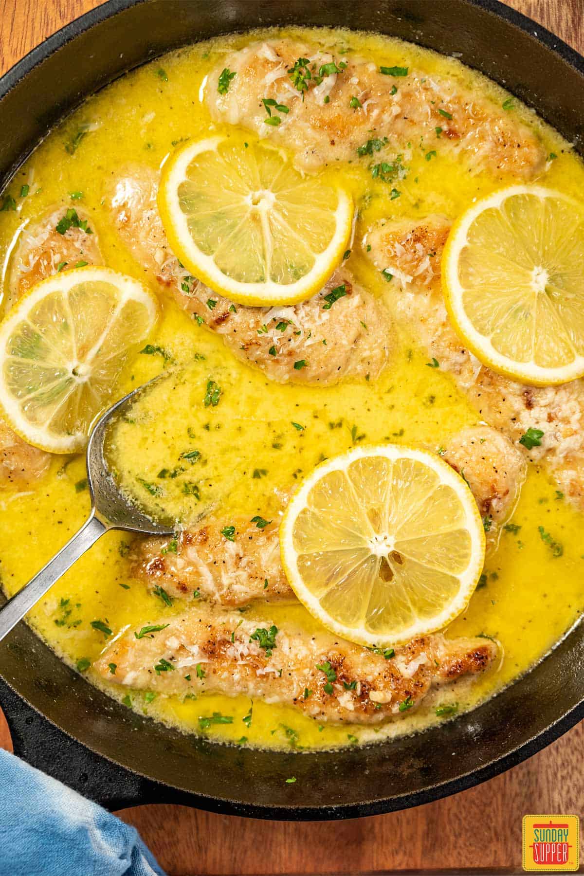 lemon butter sauce with chicken tenders in pan