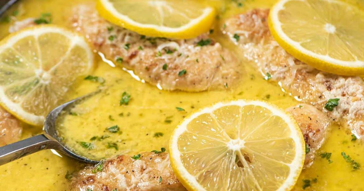 lemon butter chicken tenders cooking in pan with sauce