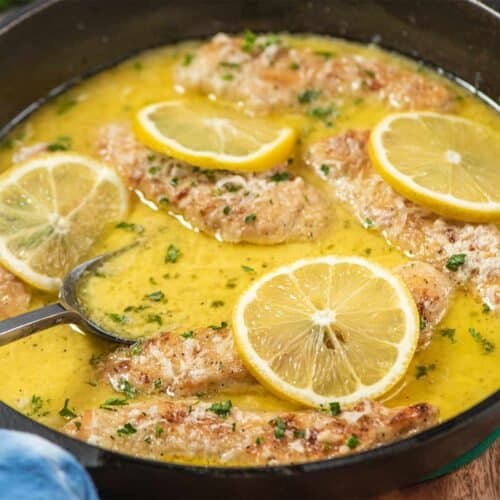 lemon butter chicken tenders cooking in pan with sauce