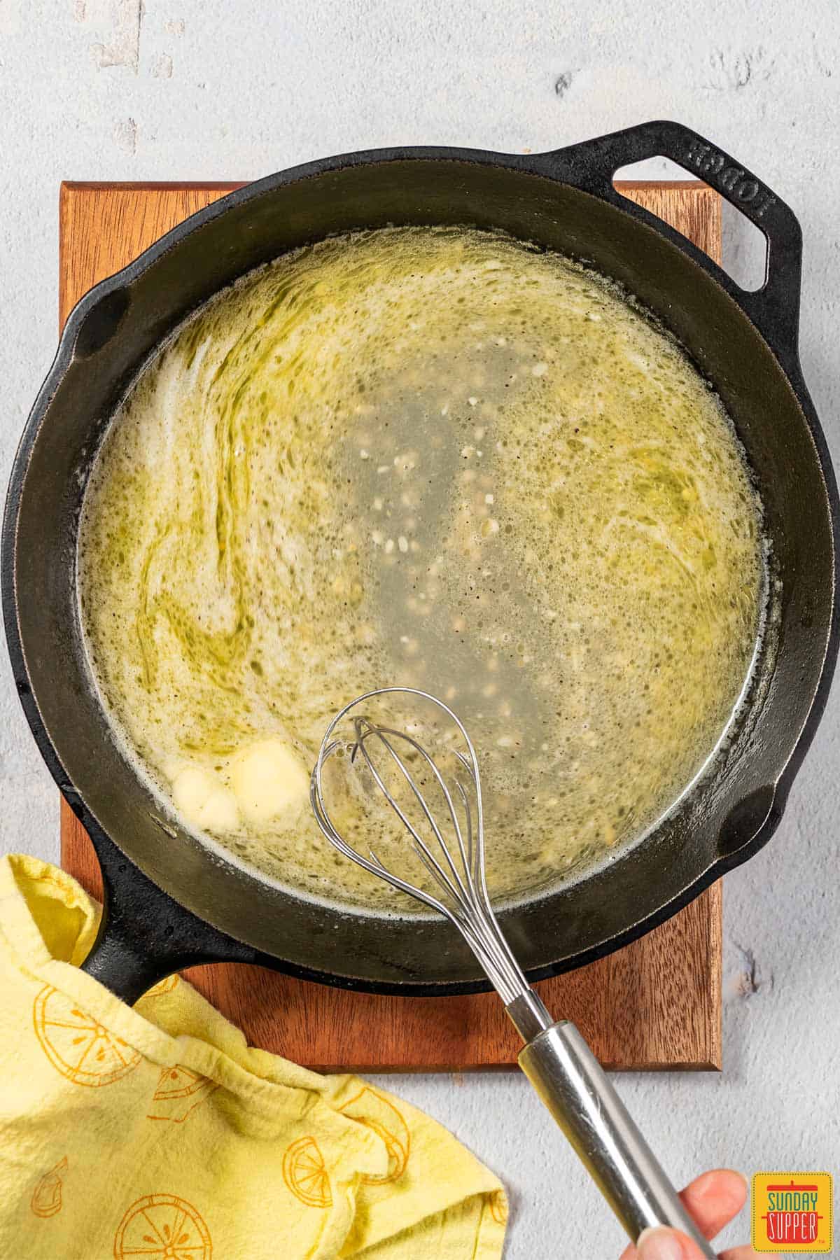 melting butter into lemon butter sauce