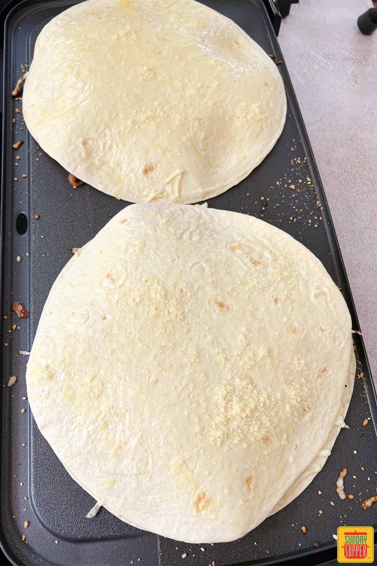 covering quesadilla with second tortilla