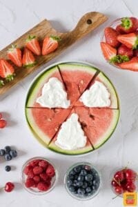spreading coconut yogurt on watermelon slices