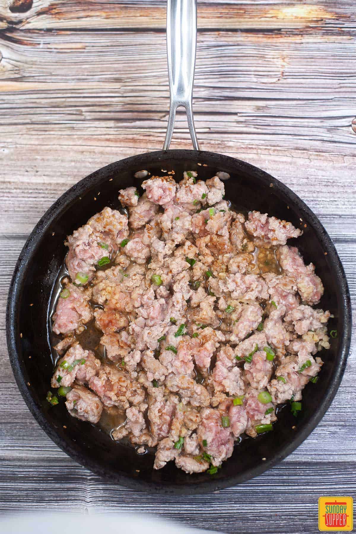 browning pork in a pan